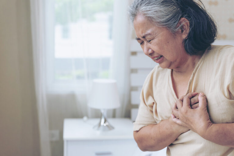senior female asian suffering from bad pain his chest heart attack home senior heart disease